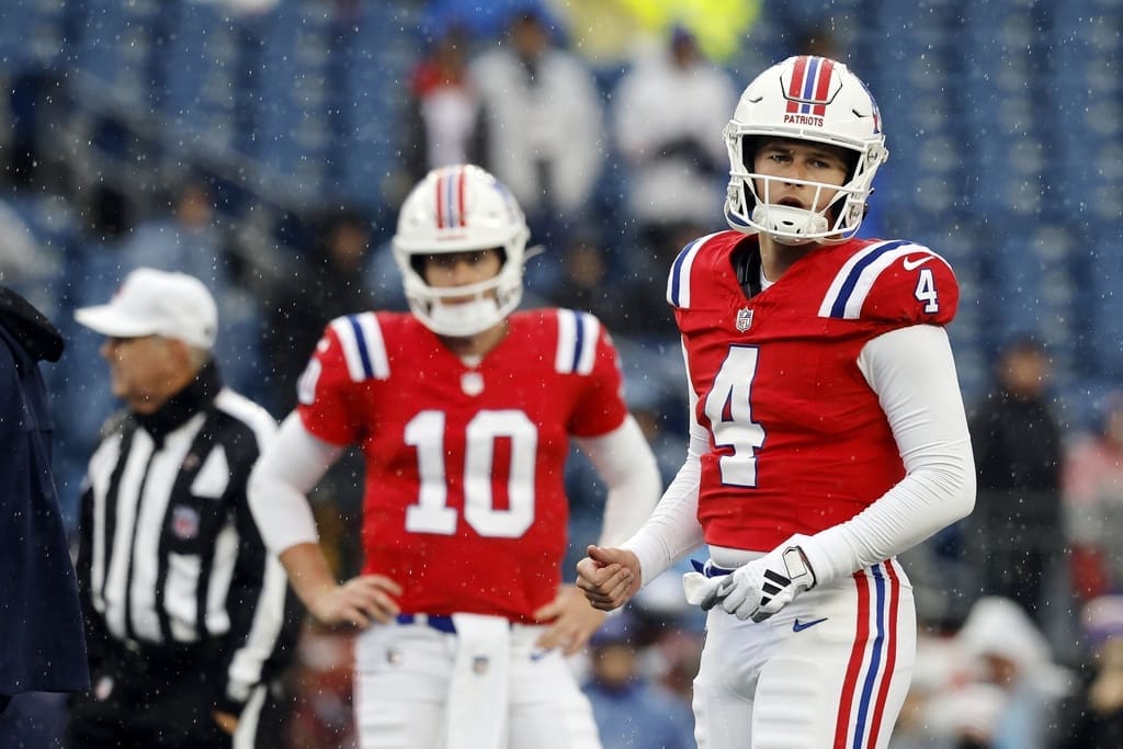 New England Patriots quarterback Bailey Zappe (4) and quarterback Mac Jones (10) prior to an NFL football game against the Los Angeles Chargers, Sunday, Dec. 3, 2023, in Foxborough, Mass. (AP Photo/Michael Dwyer)