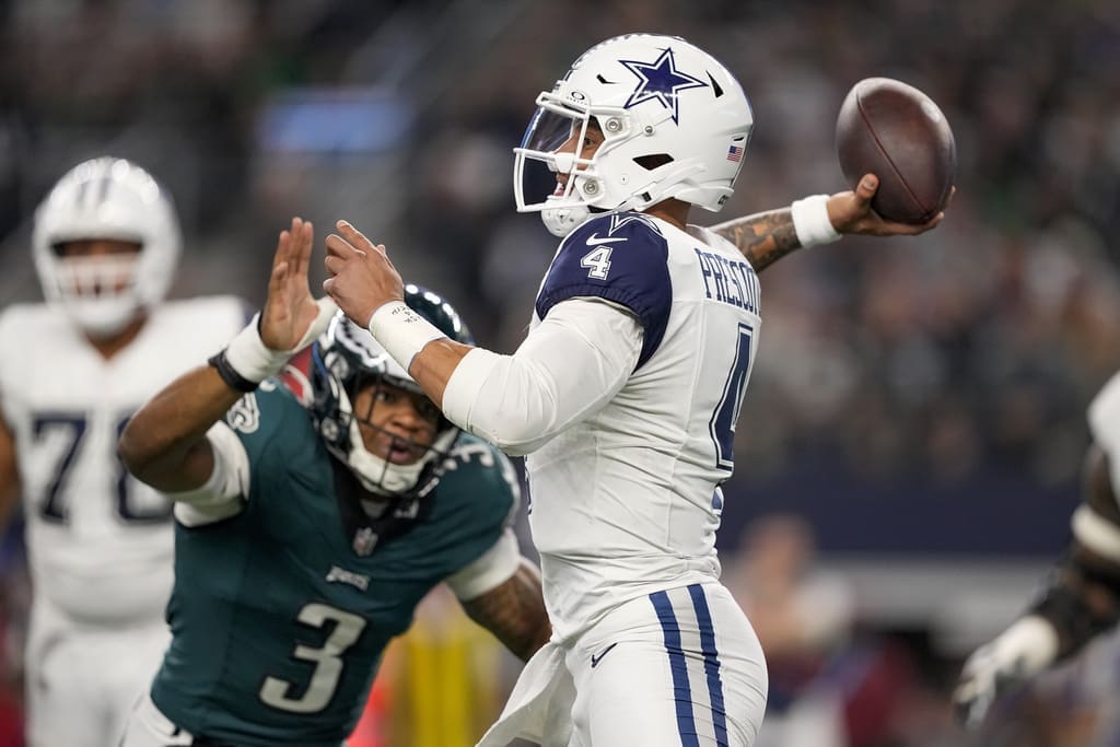 Dallas Cowboys quarterback Dak Prescott (4) attempts a pass with pressure from Philadelphia Eagles linebacker Nolan Smith (3) during the first half of an NFL football game, Sunday, Dec. 10, 2023, in Arlington, Texas. Dallas moves up to third in this week's NFL Power Rankings (AP Photo/Sam Hodde)