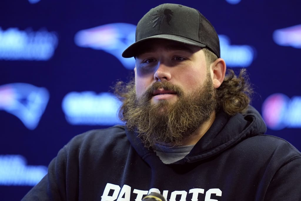 New England Patriots center David Andrews talks with reporters during a media availability before NFL football practice, Thursday, Dec. 14, 2023, in Foxborough, Mass. (AP Photo/Charles Krupa)