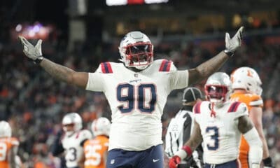 New England Patriots defensive tackle Christian Barmore (90) reacts after a play during the second half of an NFL football game against the Denver Broncos, Sunday, Dec. 24, 2023, in Denver. (AP Photo/David Zalubowski)