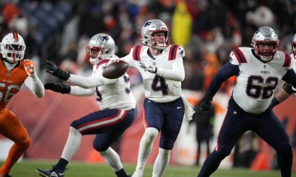 New England Patriots quarterback Bailey Zappe (4) in the first half of an NFL football game in Empower Field at Mile High Sunday, Dec. 24, 2023, in Denver. (AP Photo/David Zalubowski)