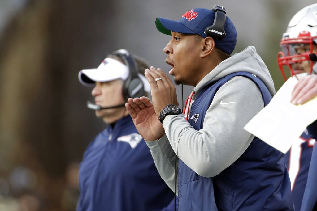 New England Patriots outside linebackers coach DeMarcus Covington works along the sideline in the first half of an NFL football game against the Miami Dolphins, Sunday, Dec. 29, 2019, in Foxborough, Mass. (AP Photo/Elise Amendola)