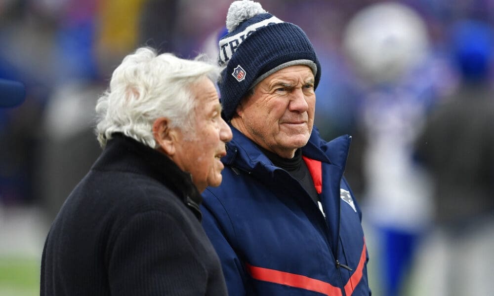 New England Patriots head coach Bill Belichick meets with Patriots owner Robert Kraft, left, before an NFL football game against the Buffalo Bills, Sunday, Jan. 8, 2023, in Orchard Park, N.Y. (AP Photo/Adrian Kraus)