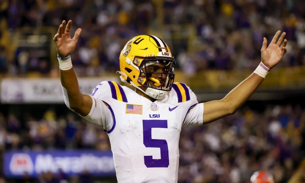 LSU quarterback Jayden Daniels (5) celebrates after a touchdown against Florida during the second half of an NCAA college football game in Baton Rouge, La., Saturday, Nov. 11, 2023. (AP Photo/Derick Hingle)