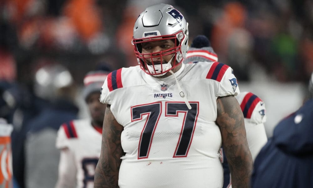 New England Patriots offensive tackle Trent Brown (77) in the first half of an NFL football game in Empower Field at Mile High Sunday, Dec. 24, 2023, in Denver. (AP Photo/David Zalubowski)