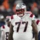 New England Patriots offensive tackle Trent Brown (77) in the first half of an NFL football game in Empower Field at Mile High Sunday, Dec. 24, 2023, in Denver. (AP Photo/David Zalubowski)