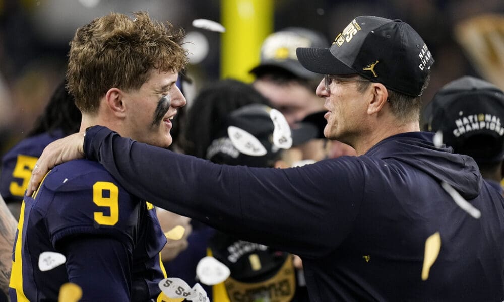 Michigan quarterback J.J. McCarthy celebrates their win with head coach Jim Harbaugh against Washington in the national championship NCAA College Football Playoff game Monday, Jan. 8, 2024, in Houston.Could either end up with the New England Patriots next season? (AP Photo/Eric Gay)