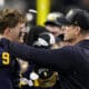 Michigan quarterback J.J. McCarthy celebrates their win with head coach Jim Harbaugh against Washington in the national championship NCAA College Football Playoff game Monday, Jan. 8, 2024, in Houston.Could either end up with the New England Patriots next season? (AP Photo/Eric Gay)