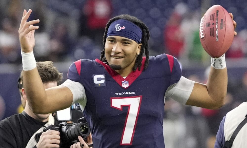 While the New England Patriots watch from home, Houston Texans quarterback C.J. Stroud celebrates after their win against the Cleveland Browns in an NFL wild-card playoff football game Saturday, Jan. 13, 2024, in Houston. (AP Photo/David J. Phillip)