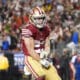 San Francisco 49ers running back Christian McCaffrey (23) celebrates his rushing touchdown during the second half of an NFL football NFC divisional playoff game against the Green Bay Packers Saturday, Jan. 20, 2024, in Santa Clara, Calif. (AP Photo/Ashley Landis)