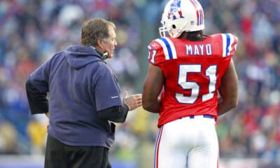 New England Patriots head coach Bill Belichick talks with Jerod Mayo (51) in the first quarter of an NFL football game against the Minnesota Vikings in Foxborough, Mass., Sunday, Oct. 31, 2010. (AP Photo/Michael Dwyer)