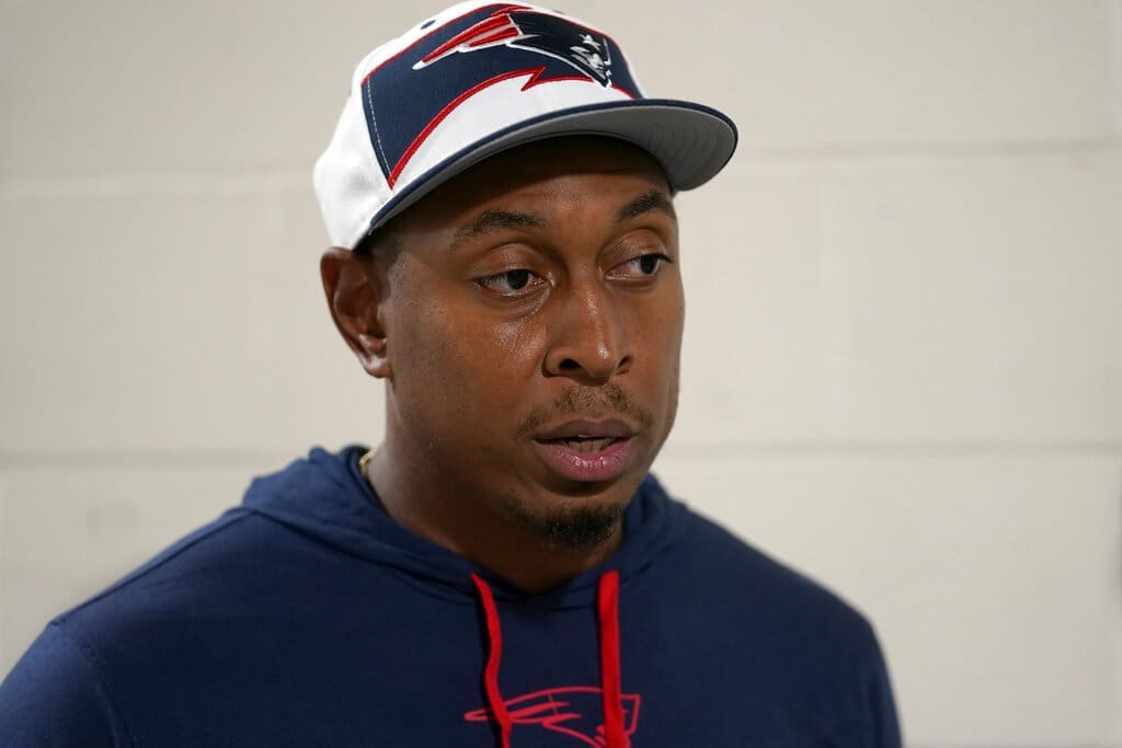 New England Patriots defensive coordinator, then the defensive line coach, DeMarcus Covington faces reporters, Monday, Aug. 29, 2022, at the NFL football team's stadium, in Foxborough, Mass. (AP Photo/Steven Senne)