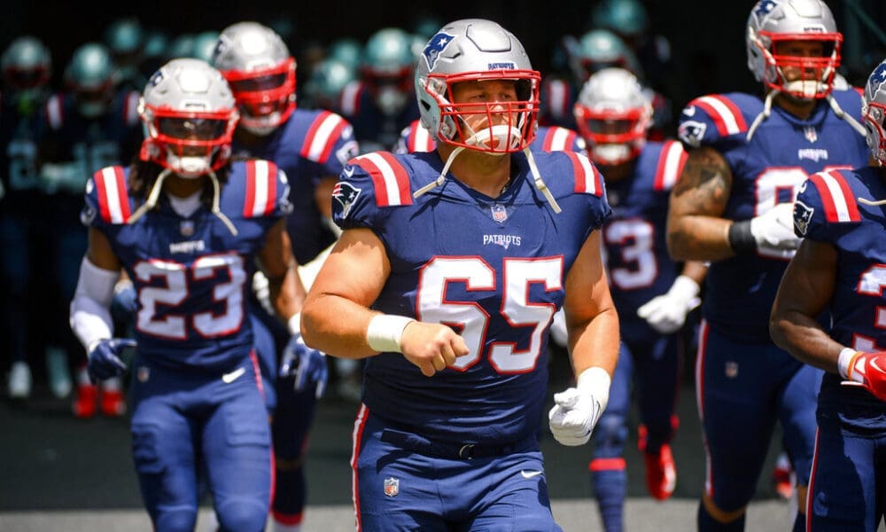 New England Patriots offensive lineman James Ferentz (65) runs onto the field during an NFL football game against the Miami Dolphins Sunday, Sept. 11, 2022, in Miami Gardens, Fla. (AP Photo/Doug Murray)