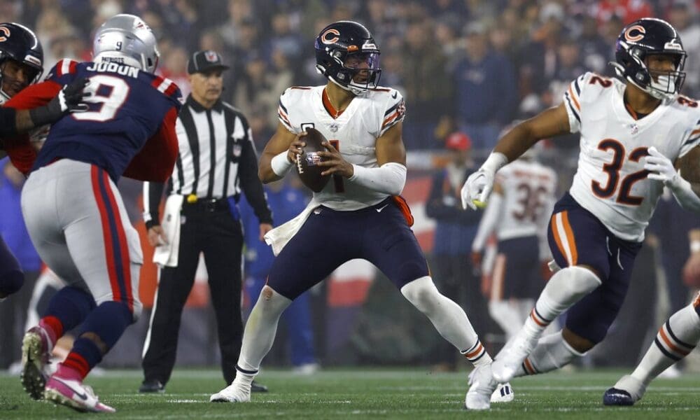 Chicago Bears quarterback Justin Fields (1) plays against the New England Patriots during the first half of an NFL football game, Monday, Oct. 24, 2022, in Foxborough, Mass. (AP Photo/Michael Dwyer)