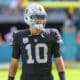 Las Vegas Raiders quarterback Jimmy Garoppolo (10) stands on the field before an NFL football game against the Miami Dolphins, Sunday, Nov. 19, 2023, in Miami Gardens, Fla. Garoppolo is a former member of the New England Patriots. (AP Photo/Doug Murray)