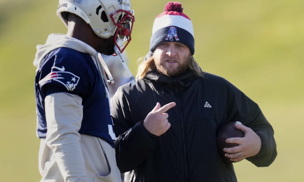 New England Patriots safeties coach Steve Belichick, right, talks with linebacker Mack Wilson Sr. during an NFL football practice, Wednesday, Jan. 3, 2024, in Foxborough, Mass. (AP Photo/Charles Krupa)