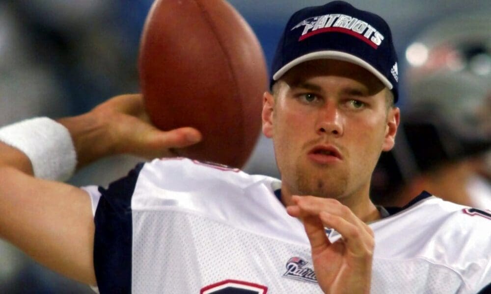 FILE - In this Aug. 4, 2000, file photo, New England Patriots backup quarterback Tom Brady warms up on the sidelines before an NFL football game against the Detroit Lions at the Silverdome in Pontiac, Mich. Brady grew from a sixth-round draft choice into one of the best quarterbacks in NFL history. On Tuesday, NFL commissioner Roger Goodell hears Brady's appeal of a four-game suspension for using deflated footballs in the AFC championship game. How will that affect Brady's legacy? (AP Photo/Carlos Osorio, File)
