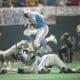 Houston Oilers fullback Alonzo Highsmith (32) goes jumping over fallen players in the third quarter of the NFL playoff game at Houston, Texas., Sunday, Jan. 3, 1988. Highsmith was hurt on the play after picking up six yards. (AP Photo/DGB)