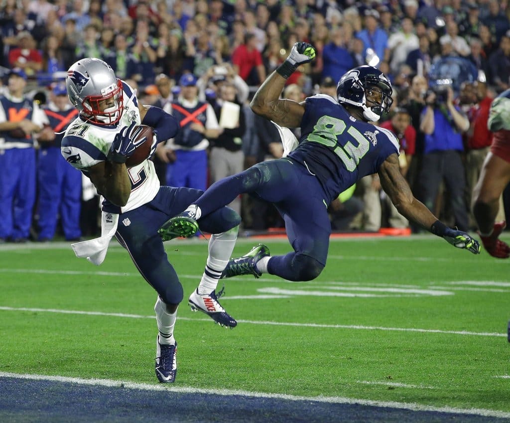 FILE - In this Feb. 1, 2015, file photo, New England Patriots strong safety Malcolm Butler (21) intercepts a pass intended for Seattle Seahawks wide receiver Ricardo Lockette (83) during the second half of the NFL football Super Bowl 49 in Glendale, Ariz. Butler's interception at the goal line that turned what looked like a likely Seattle repeat title into the fourth championship for Tom Brady and the Patriots three years ago might be the most impactful play of any kind in the Super Bowl when it comes to determining the champion. (AP Photo/Kathy Willens, File)