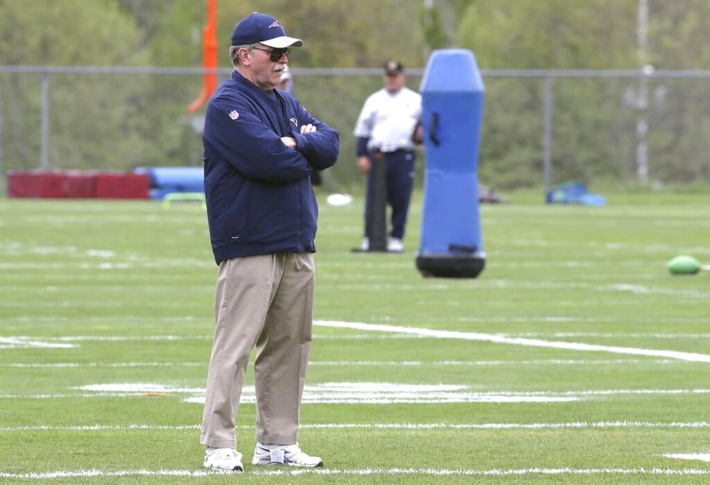 FILE — Ernie Adams, football research director for the New England Patriots, watches during NFL football practice, in Foxborough, Mass., in this Thursday, May 23, 2019 file photo. Adams, a former high school classmate of coach Bill Belichick, participated in his final practice with the team Wednesday, June 16, 2021. Adams retired from his job at the Patriots, Wednesday, June 16, after 21 years with the team. (AP Photo/Charles Krupa, File)
