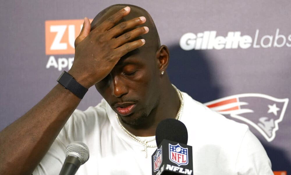 New England Patriots safety Devin McCourty (32) gestures during a post game news conference after an NFL football game against the Miami Dolphins, Sunday, Sept. 11, 2022, in Miami Gardens, Fla. The Dolphins defeated the Patriots 20-7. (AP Photo/Lynne Sladky)