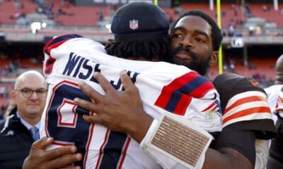 Cleveland Browns quarterback Jacoby Brissett (7) hugs New England Patriots defensive end Deatrich Wise Jr. (91) after an NFL football game, Sunday, Oct. 16, 2022, in Cleveland. (AP Photo/Kirk Irwin)