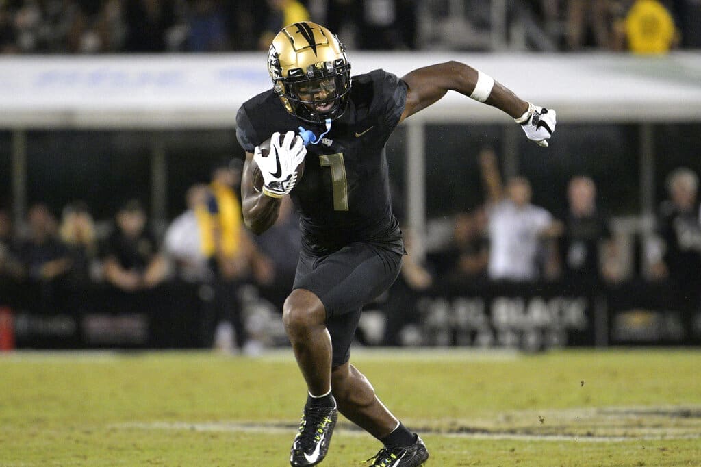 Patriots draft target, Central Florida wide receiver Javon Baker (1) runs after catching a pass during the second half of an NCAA college football game against Louisville on Friday, Sept. 9, 2022, in Orlando, Fla. (AP Photo/Phelan M. Ebenhack)