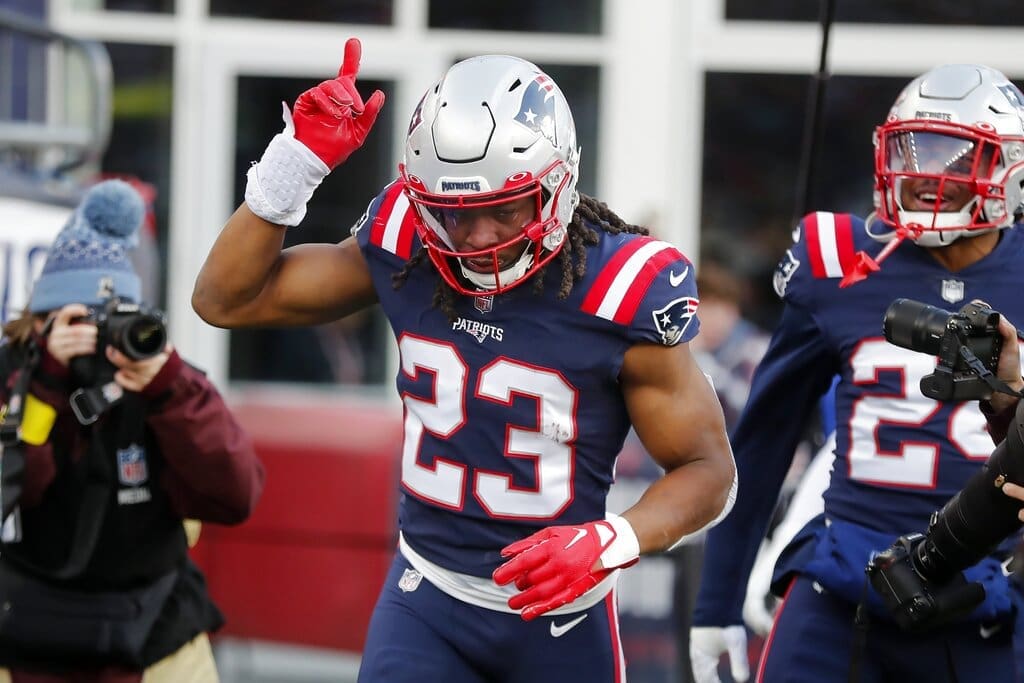 New England Patriots safety Kyle Dugger celebrates after scoring on an interception during the second half of an NFL football game against the Miami Dolphins, Sunday, Jan. 1, 2023, in Foxborough, Mass. (AP Photo/Michael Dwyer)