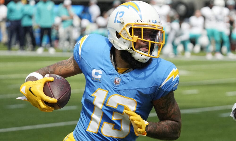 Los Angeles Chargers wide receiver Keenan Allen (13) runs after a catch against the Miami Dolphins during the first half of an NFL football game Sunday, Sept. 10, 2023, in Inglewood, Calif. Allen has been traded, but not to the New England Patriots. (AP Photo/Mark J. Terrill)