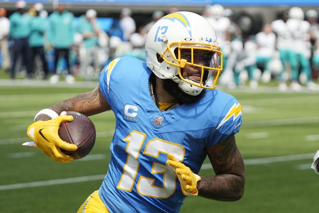 Los Angeles Chargers wide receiver Keenan Allen (13) runs after a catch against the Miami Dolphins during the first half of an NFL football game Sunday, Sept. 10, 2023, in Inglewood, Calif. Allen has been traded, but not to the New England Patriots. (AP Photo/Mark J. Terrill)