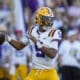 LSU QB Jayden Daniels (5) drops back to pass in the first half of an NCAA college football game against Auburn in Baton Rouge, La., Saturday, Oct. 14, 2023. (AP Photo/Gerald Herbert)