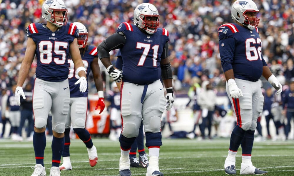 New England Patriots tight end Hunter Henry (85), guard Mike Onwenu (71) and guard Sidy Sow (62) prepares to line up during the second half of an NFL football game against the Buffalo Bills on Sunday, Oct. 22, 2023, in Foxborough, Mass. (AP Photo/Greg M. Cooper)