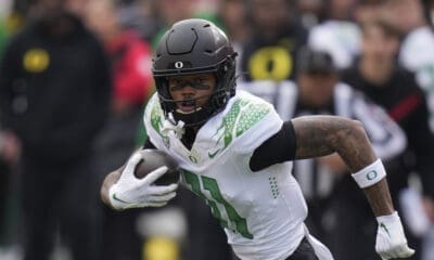 New England Patriots NFL Draft target,Oregon wide receiver Troy Franklin (11) carries the ball during the first half of an NCAA college football game against Utah Saturday, Oct. 28, 2023, in Salt Lake City. (AP Photo/Rick Bowmer)
