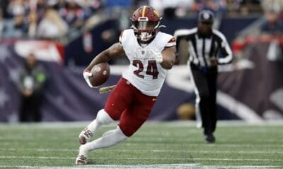 Washington Commanders running back Antonio Gibson (24) carries the ball in the first half of an NFL football game against the New England Patriots, Sunday, Nov. 5, 2023, in Foxborough, Mass. (AP Photo/Michael Dwyer)