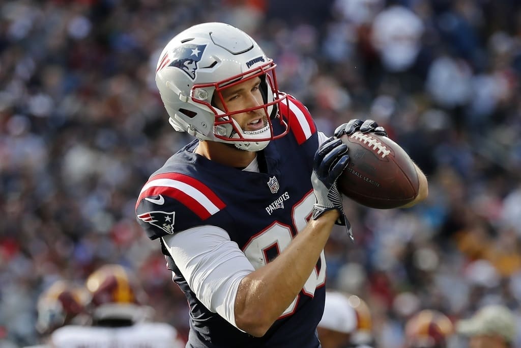 New England Patriots tight end Mike Gesicki warms up before an NFL football game against the Washington Commanders, Sunday, Nov. 5, 2023, in Foxborough, Mass. (AP Photo/Michael Dwyer)