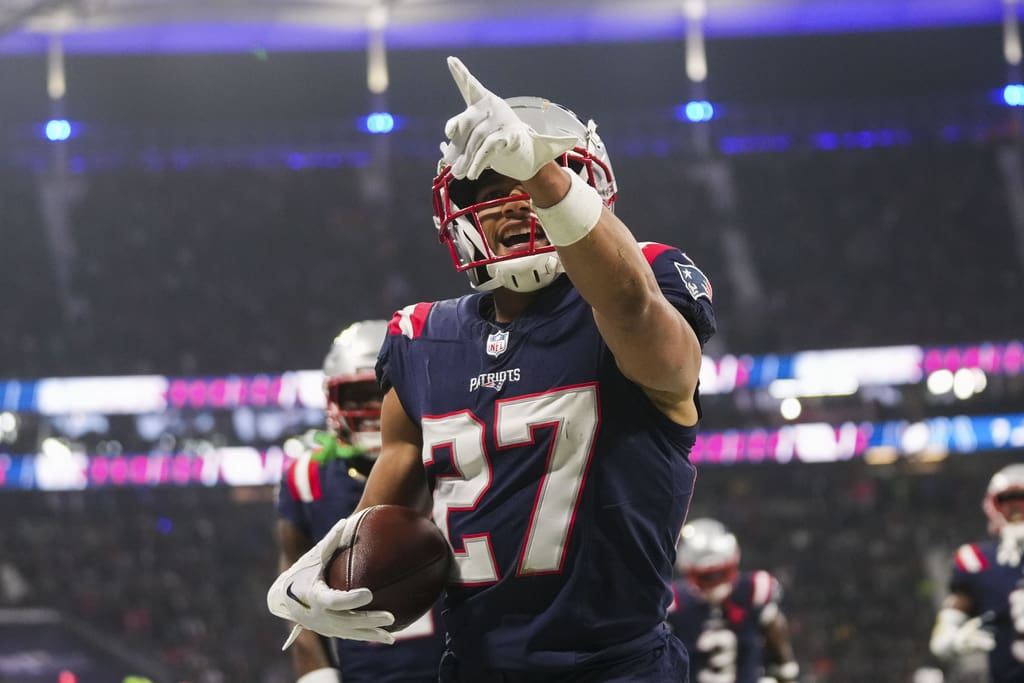 New England Patriots cornerback Myles Bryant (27) celebrates his interception in the second half of an NFL football game against the Indianapolis Colts in Frankfurt, Germany Sunday, Nov. 12, 2023. (AP Photo/Michael Probst)