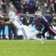 Indianapolis Colts wide receiver Michael Pittman Jr. (11) reaches out to bring in a catch over New England Patriots defensive back Jack Jones (13) during an NFL football game at Deutsche Bank Park Stadium in Frankfurt, Germany, Sunday, Nov. 12, 2023. (AP Photo/Doug Benc)