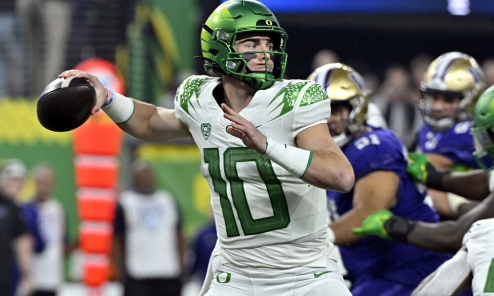 FILE - Oregon quarterback Bo Nix looks to pass against Washington during the first half of the Pac-12 championship NCAA college football game Friday, Dec. 1, 2023, in Las Vegas. Nix is one of the top quarterbacks in the 2024 NFL Draft. (AP Photo/David Becker, File)