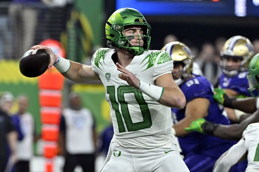 FILE - Oregon quarterback Bo Nix looks to pass against Washington during the first half of the Pac-12 championship NCAA college football game Friday, Dec. 1, 2023, in Las Vegas. Nix is one of the top quarterbacks in the 2024 NFL Draft. (AP Photo/David Becker, File)