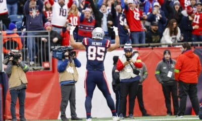 New England Patriots tight end Hunter Henry (85) waves to the crowd after scoring touchdown during the first half of an NFL football game Kansas City Chiefs on Sunday, Dec. 17, 2023, in Foxborough, Mass. (AP Photo/Greg M. Cooper)