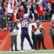 New England Patriots tight end Hunter Henry (85) waves to the crowd after scoring touchdown during the first half of an NFL football game Kansas City Chiefs on Sunday, Dec. 17, 2023, in Foxborough, Mass. (AP Photo/Greg M. Cooper)