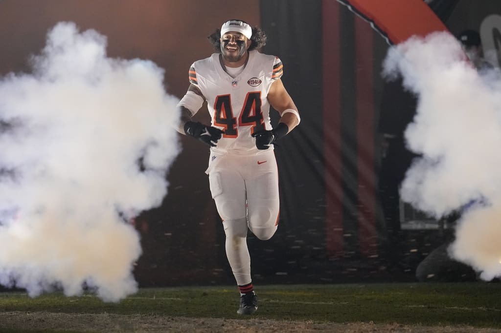 Cleveland Browns linebacker Sione Takitaki (44) is introduced before an NFL football game against the New York Jets, Thursday, Dec. 28, 2023, in Cleveland. (AP Photo/Sue Ogrocki)
