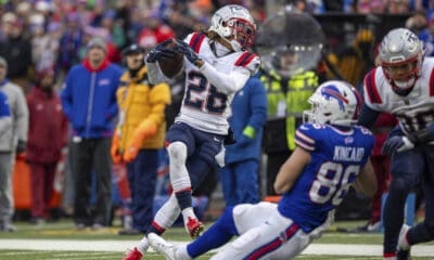 New England Patriots cornerback Alex Austin (28) intercepts pass during an NFL football game, Sunday, Dec. 31, 2023, in Orchard Park, NY. (AP Photo/Matt Durisko)