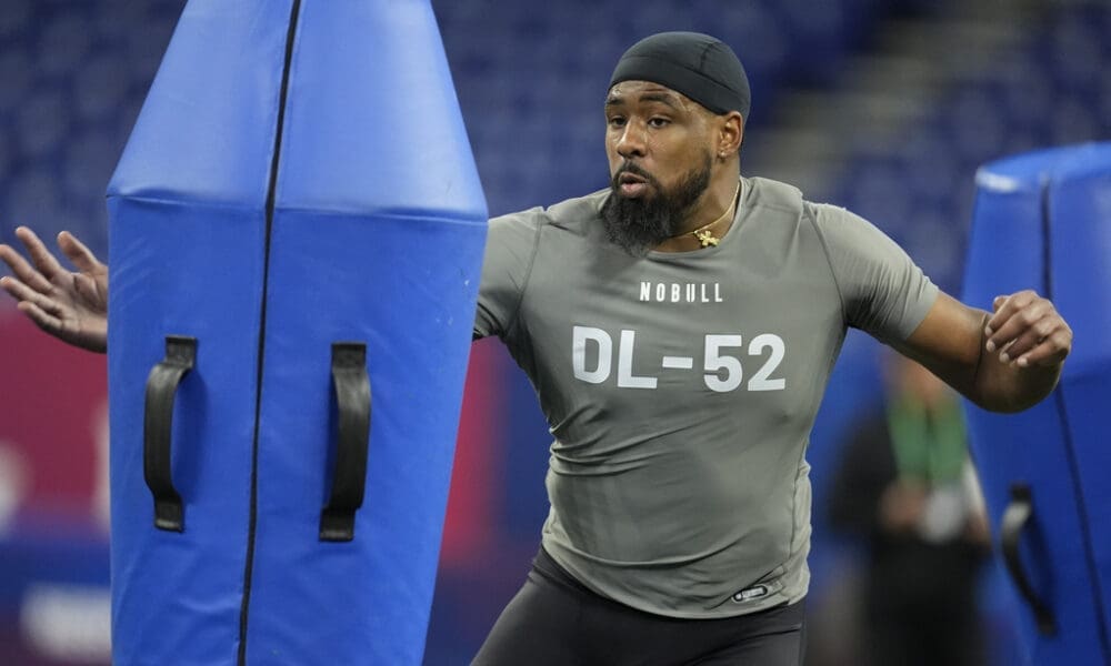 NFL Draft prospect, Connecticut defensive lineman Eric Watts runs a drill at the NFL football scouting combine, Thursday, Feb. 29, 2024, in Indianapolis. (AP Photo/Michael Conroy)