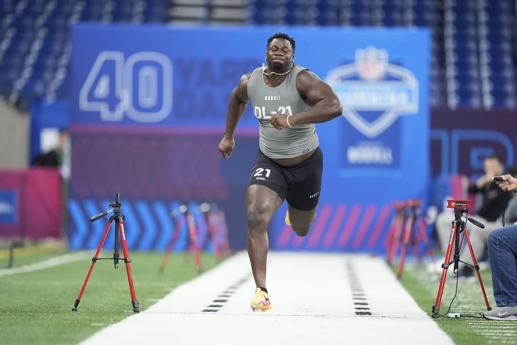 Clemson defensive lineman Ruke Orhorhoro runs the 40-yard dash at the NFL football scouting combine, Thursday, Feb. 29, 2024, in Indianapolis. Orhorhoro saw his NFL Draft stock rise at the combine. (AP Photo/Michael Conroy)