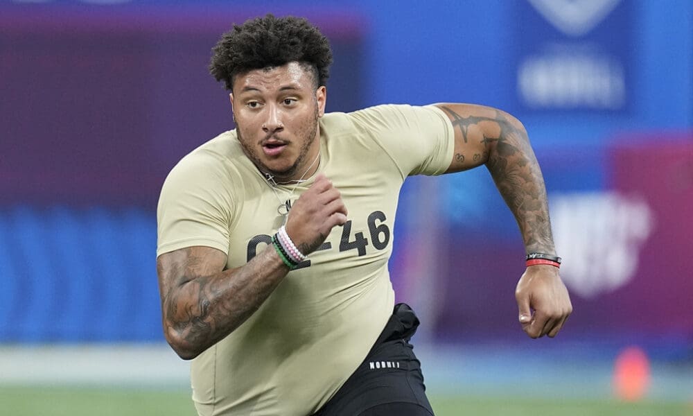 Boston College offensive lineman Christian Mahogany runs a drill at the NFL football scouting combine, Sunday, March 3, 2024, in Indianapolis. (AP Photo/Darron Cummings)