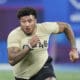Boston College offensive lineman Christian Mahogany runs a drill at the NFL football scouting combine, Sunday, March 3, 2024, in Indianapolis. (AP Photo/Darron Cummings)