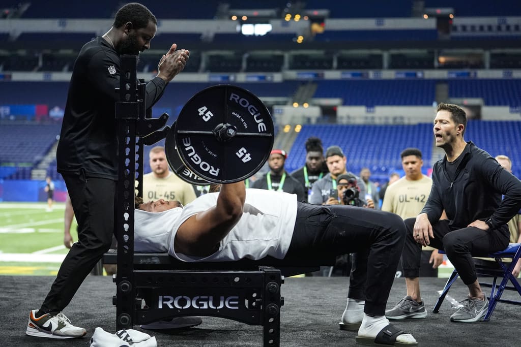 New England Patriots draft prospect, Brigham Young offensive lineman Kingsley Suamataia participates in the bench press at the NFL football scouting combine in Indianapolis, Monday, March 4, 2024. (AP Photo/Michael Conroy)