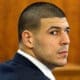 Former NFL player Aaron Hernandez of the New England Patriots listens during his murder trial at the Bristol County Superior Court in Fall River, Mass., Wednesday, Feb. 18, 2015. Hernandez is accused in the June 17, 2013, killing of Odin Lloyd, who was dating his fiancée's sister. (AP Photo/Dominick Reuter, Pool)