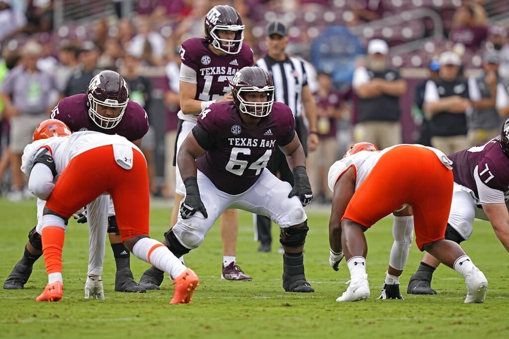 Texas A&M offensive lineman Layden Robinson (64) blocks against Sam Houston State during the first half of an NCAA college football game Saturday, Sept. 3, 2022, in College Station, Texas. (AP Photo/David J. Phillip)